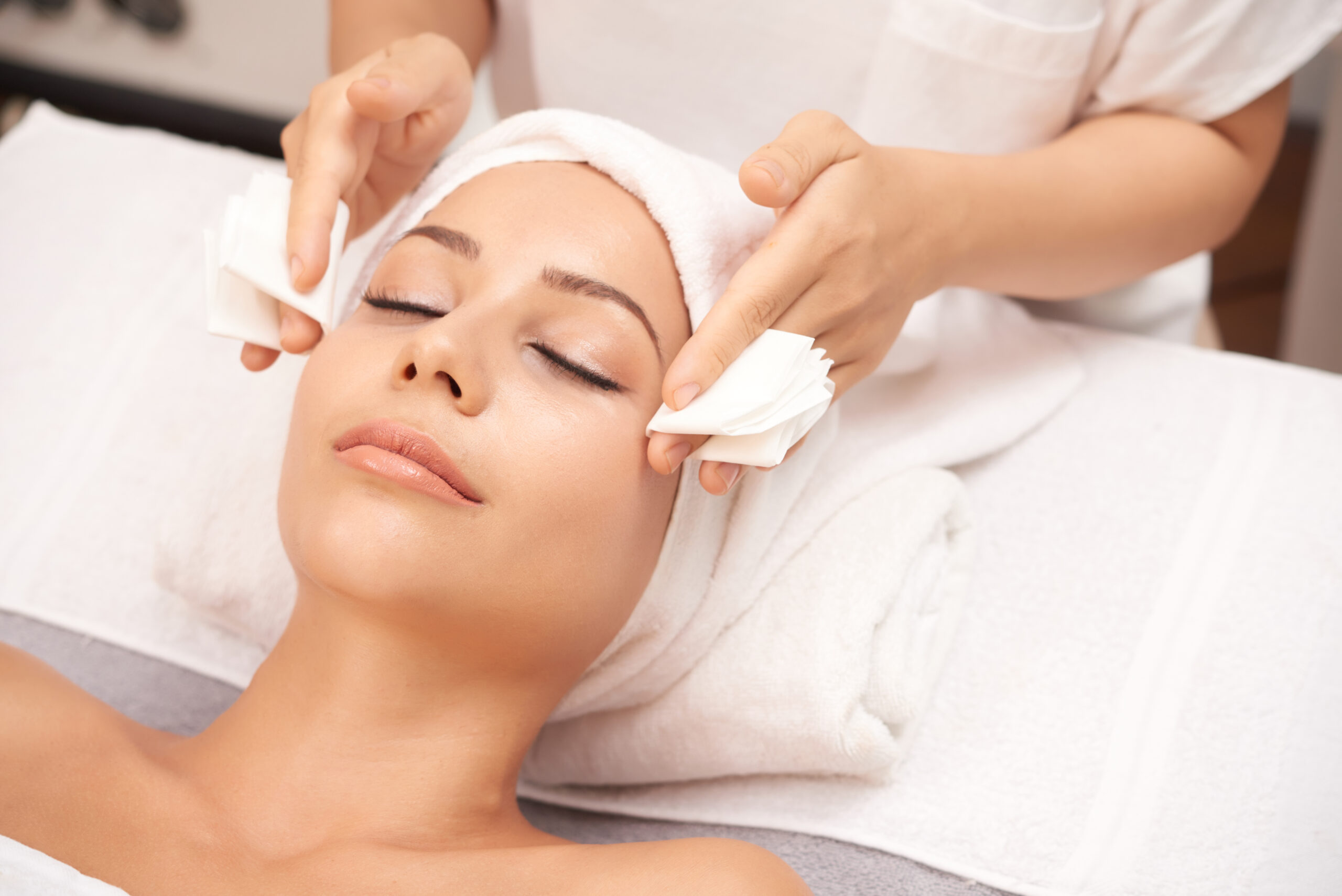 attractive woman getting face beauty procedures spa salon scaled